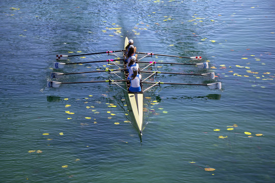 Ladies fours rowing team in race on the lake