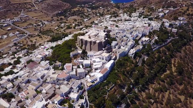 August 2017: Aerial drone video of iconic monastery and medieval castle of Saint John the Theologian with views to chora village, port of Skala and entire Patmos island, Dodecanese, Greece