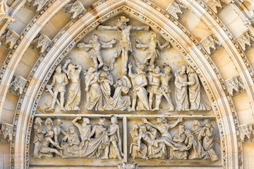 Obraz premium Prague, Czech Republic - August 19, 2017: Detail of white marble sculpture on the entrance door of the cathedral of San Vito