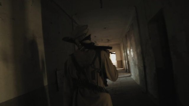 Man with the rifle on his shoulder