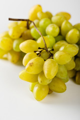 Closeup of green grapes on white background