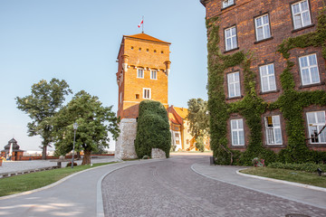 View on the inner courtyard of Wawel castle with Thieves tower during the sunny morning in Krakow