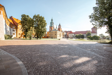 Fototapeta premium View on the inner courtyard of Wawel castle with chapels and Basilica of saint Stanislaus and Wenceslaus during the sunny morning in Krakow