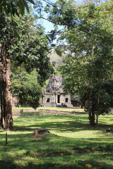 Fototapeta na wymiar Ruins and walls of an ancient city in Angkor complex, near the ancient capital of Cambodia - Siem Reap