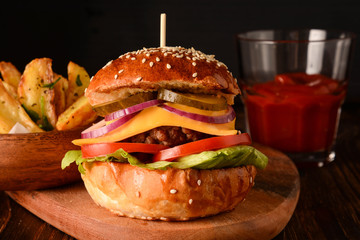 Homemade burger with fresh vegetables.