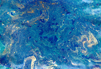 Marbled abstract background. Liquid marble pattern. Colorful marble backdrop. Golden glitter texture.