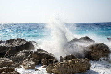 Enormous waves crashing on the shore and on the rocks at the Kavalikefta Beach at the sunset, Lefkada Island, Greece