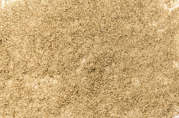 Golden dust texture. Bright shine. Golden powder surface. Yellow glitter. Shining sequins background.