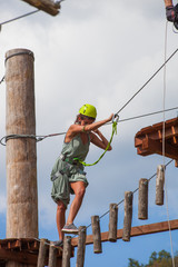 young woman in adventure park summer challenge