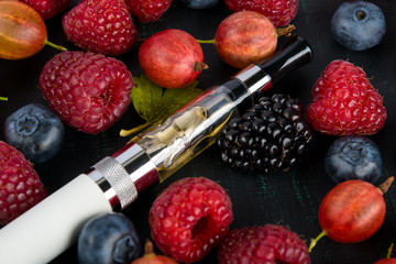 on a black background, a set of ripe garden berries, for an electronic cigarette taste