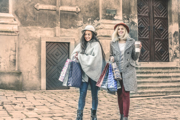 Obraz na płótnie Canvas Two best friends walking on the street . Young female best friends doing shopping on the streets.