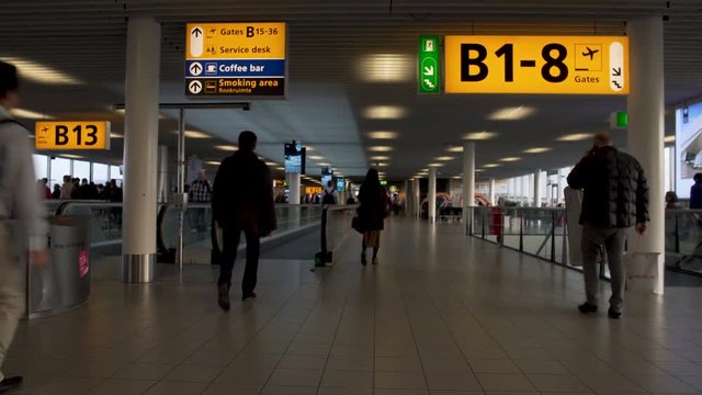 Busy male and female passengers hurrying to gate at airport terminal, trip