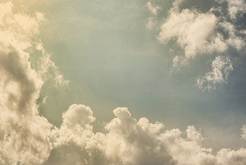 Cloudy sky in a sunny day. Vintage stylization