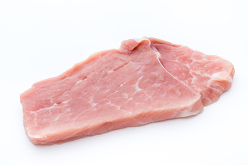 Fresh pork fillet with basil on a white background.