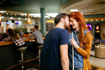 Couple spending time together by playing pool