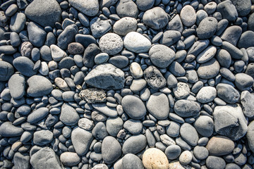 Textura with different sized stones lying on the beach in Iceland