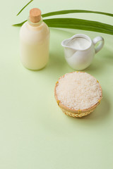 Milk and rice in bowl on light background.