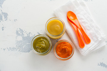 Homemade vegetable and fruit puree with ingredients on white background. Space for text