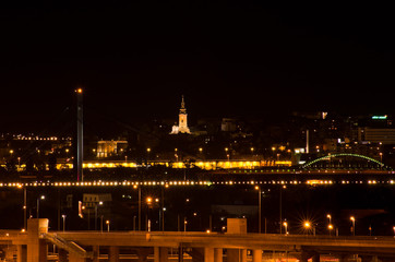 Fototapeta na wymiar Night scene from Sava river of Belgrade downtown with Serbian orthodox cathedral in the middle, Serbia