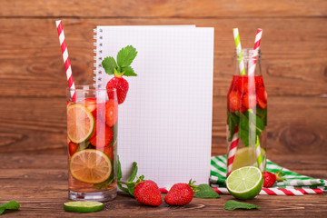 Fresh lemonade with strawberries, lime and mint