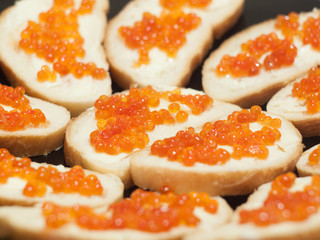 Dish with red caviare sandwiches