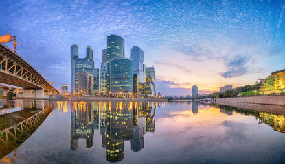 Cityscape of Moscow city business district reflecting in Moskva river in the morning - obrazy, fototapety, plakaty
