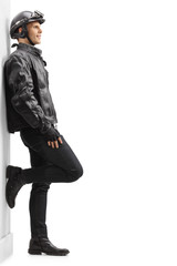 Biker leaning against wall