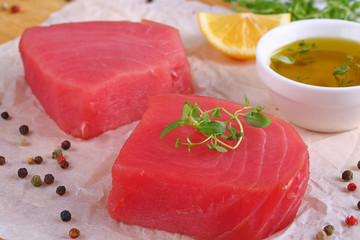 tuna fish steaks on cutting board