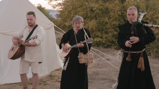 Perfomance medieval ensemble of monks Templars