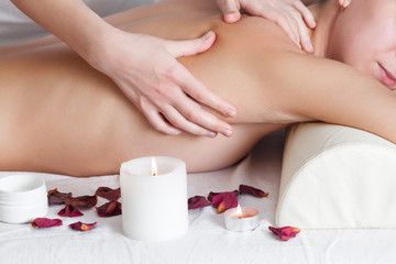 Back massage of a woman close up
