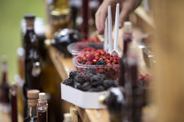 mixed fresh berries on a table for sale