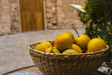 wicker basket with organic oranges