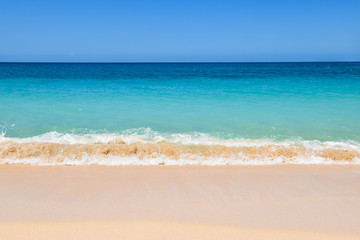 Fototapeta na wymiar Beautiful beach in Grenada, Caribbean. Idyllic ocean view with turquoise blue water, clear blue ocean and white sandy beach.