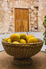 wicker basket with organic oranges