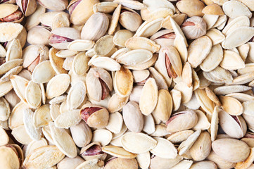 Pistachio and pumpkin seeds background texture