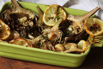 fried artichokes with garlic and lemon on pan