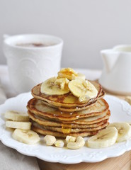 Homemade Banana Cashew Pancakes Honey Sauce Milk Flour Wooden Table Kitchen Towel Cutlery 