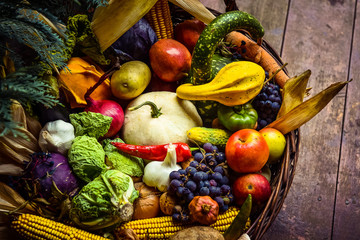 Heap of fresh fruits and vegetables in basket