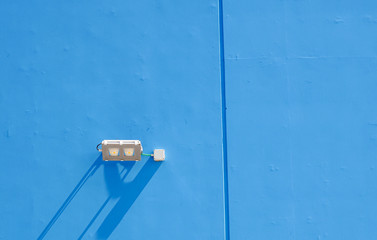 LED floodlight on wall of industrial covered