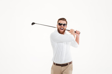 Young screaming emotional bearded man holding golfstick