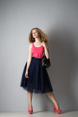 Young beautiful woman in pink shoes