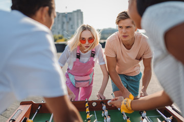 friends playing table football