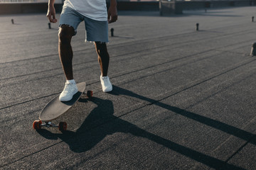 Fototapeta premium man riding on skateboard on rooftop