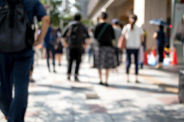 People Walking in the Middle of the City During Day at the City of Nagoya in Japan; Blur Background with Bokeh Effects