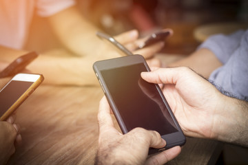 Vintage of Group of businessman use phone on wood table, concept as connection, business technology and internet