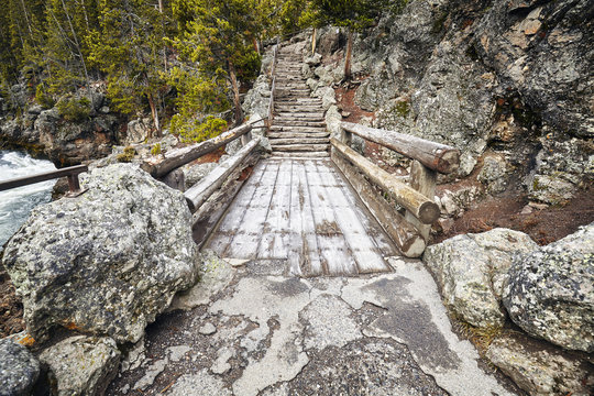 Wooden bridge and stone stairs in the Yellowstone National Park, Wyoming, USA.