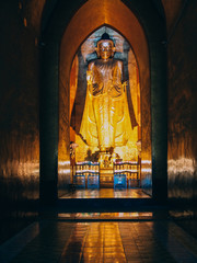 Myanmar, Bagan - Buddha inside of Pagoda, ambient light