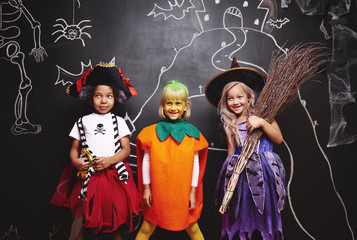 Group of kids at Halloween © gpointstudio