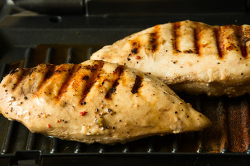 Chicken breasts on a grill. Selective focus