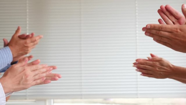 Clapping hands on white background. 4k. slow motion. copy space
